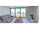 Bright living room with large windows offering stunning city and ocean views, with comfortable furniture and stylish decor at 1 Oceans W Blvd # 22A3, Daytona Beach, FL 32118