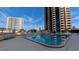 Inviting outdoor pool area with ample seating and lounge chairs at 1 Oceans W Blvd # 22A3, Daytona Beach, FL 32118