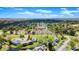 Aerial view of waterfront community with pool, clubhouse, and parking at 105 Wood Duck Cir # 1C, Daytona Beach, FL 32119