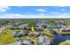 Aerial view of condo community, highlighting a two-story unit near a lake at 105 Wood Duck Cir # 1C, Daytona Beach, FL 32119