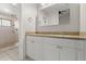 Well-appointed bathroom with double sinks, granite countertops, and a tiled shower at 105 Wood Duck Cir # 1C, Daytona Beach, FL 32119