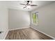 Bright bedroom with a ceiling fan and a large window offering plenty of natural light at 105 Wood Duck Cir # 1C, Daytona Beach, FL 32119