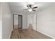 Bedroom features a ceiling fan and mirrored closet, providing ample storage at 105 Wood Duck Cir # 1C, Daytona Beach, FL 32119
