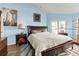 Bright bedroom with a king-size bed and wood furniture at 105 Wood Duck Cir # 1C, Daytona Beach, FL 32119