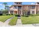 Two-story condo with landscaped yard and walkway at 105 Wood Duck Cir # 1C, Daytona Beach, FL 32119