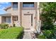Close-up of the front entrance with stone pillar details and meticulously manicured shrubbery at 105 Wood Duck Cir # 1C, Daytona Beach, FL 32119