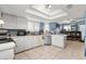 Modern kitchen with white cabinets, stainless steel appliances and tile floor at 105 Wood Duck Cir # 1C, Daytona Beach, FL 32119