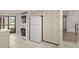 Kitchen area featuring a convenient stacked washer and dryer at 105 Wood Duck Cir # 1C, Daytona Beach, FL 32119