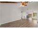 Spacious living room featuring high ceilings, a ceiling fan and hardwood flooring at 105 Wood Duck Cir # 1C, Daytona Beach, FL 32119