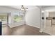 Sunlit living room boasts a large window and adjacent kitchen at 105 Wood Duck Cir # 1C, Daytona Beach, FL 32119
