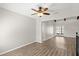Bright living room featuring new vinyl floors and ceiling fan at 105 Wood Duck Cir # 1C, Daytona Beach, FL 32119