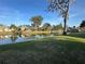 Scenic backyard with a peaceful waterfront view and well-maintained lawn at 107 Old Sunbeam Dr, South Daytona, FL 32119