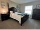 Bedroom with dark furniture and neutral walls at 107 Old Sunbeam Dr, South Daytona, FL 32119