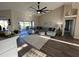 A large sectional sofa anchors the living room, complemented by a ceiling fan at 107 Old Sunbeam Dr, South Daytona, FL 32119