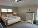 Bright and airy bedroom featuring a large bed and ample natural light at 107 Old Sunbeam Dr, South Daytona, FL 32119