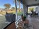 Relaxing screened porch with outdoor furniture and views of the pond at 107 Old Sunbeam Dr, South Daytona, FL 32119