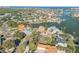 Wide aerial view of a waterfront community with many houses and waterways at 107 Via Amalfi, New Smyrna Beach, FL 32169