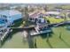 Aerial view of house, private dock, and boat slip on the waterfront at 107 Via Amalfi, New Smyrna Beach, FL 32169