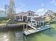 Luxury waterfront home with private dock and beautiful landscaping at 107 Via Amalfi, New Smyrna Beach, FL 32169