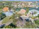 Aerial view showcasing a waterfront property, multiple houses, and a canal at 107 Via Amalfi, New Smyrna Beach, FL 32169