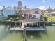 Luxury waterfront home with private dock and boat lift at 107 Via Amalfi, New Smyrna Beach, FL 32169