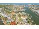 Wide aerial showcasing waterfront homes and neighborhood at 107 Via Amalfi, New Smyrna Beach, FL 32169