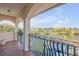 Covered balcony overlooking the water, featuring an ornate railing at 107 Via Amalfi, New Smyrna Beach, FL 32169