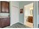 Small bathroom with toilet, sink, and dark brown vanity at 107 Via Amalfi, New Smyrna Beach, FL 32169