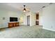 Large bedroom with TV stand, ceiling fan and access to other rooms at 107 Via Amalfi, New Smyrna Beach, FL 32169