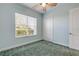 Bedroom with window, closet, and ceiling fan at 107 Via Amalfi, New Smyrna Beach, FL 32169