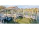 Private boat dock with covered area and multiple slips at 107 Via Amalfi, New Smyrna Beach, FL 32169