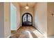 Bright entryway with tiled floors and a grand arched doorway at 107 Via Amalfi, New Smyrna Beach, FL 32169