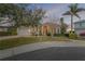 Beautiful two-story home with a three-car garage and landscaped yard at 107 Via Amalfi, New Smyrna Beach, FL 32169