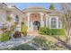 Front entrance of a house with a tiled pathway and Mediterranean-style architecture at 107 Via Amalfi, New Smyrna Beach, FL 32169