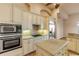 Modern kitchen with double oven and granite counters at 107 Via Amalfi, New Smyrna Beach, FL 32169