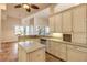 Spacious kitchen with granite countertops and island at 107 Via Amalfi, New Smyrna Beach, FL 32169