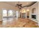 Bright living room with tile floors, fireplace, and sliding glass doors leading to a patio at 107 Via Amalfi, New Smyrna Beach, FL 32169