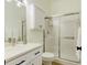 Clean bathroom with white vanity, a glass shower, and updated fixtures at 108 Tuscany Villas Dr # 15, Edgewater, FL 32141