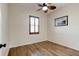 Bright bedroom featuring wood-look floors and plantation shutters at 108 Tuscany Villas Dr # 15, Edgewater, FL 32141