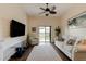 Living room with hardwood floors, ceiling fan, and sliding glass door at 108 Tuscany Villas Dr # 108, Edgewater, FL 32141