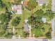 Aerial view of the property highlighting the boundaries, landscaping, and surrounding neighborhood at 115 E Turgot, Edgewater, FL 32132