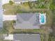 Top-down aerial view of a house with a pool in a residential area at 1155 Kilkenny Ln, Ormond Beach, FL 32174