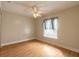 Bright bedroom featuring light wood flooring and a ceiling fan at 1155 Kilkenny Ln, Ormond Beach, FL 32174