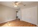 Bedroom with a large closet, ceiling fan, and wood flooring at 1155 Kilkenny Ln, Ormond Beach, FL 32174