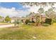 House exterior showcasing landscaping and a spacious front yard at 1155 Kilkenny Ln, Ormond Beach, FL 32174