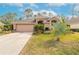 Single-story house with a two-car garage and nicely landscaped yard at 1155 Kilkenny Ln, Ormond Beach, FL 32174