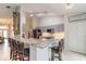 Modern kitchen with granite countertops, gray cabinets, and stainless steel appliances at 1155 Kilkenny Ln, Ormond Beach, FL 32174