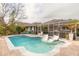 Relaxing pool area with patio and lounge chairs at 1155 Kilkenny Ln, Ormond Beach, FL 32174