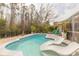 Inviting pool with patio and lounge chairs at 1155 Kilkenny Ln, Ormond Beach, FL 32174