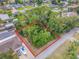 Large waterfront lot with lush vegetation, near other homes at 122 Azalea Rd, Edgewater, FL 32141